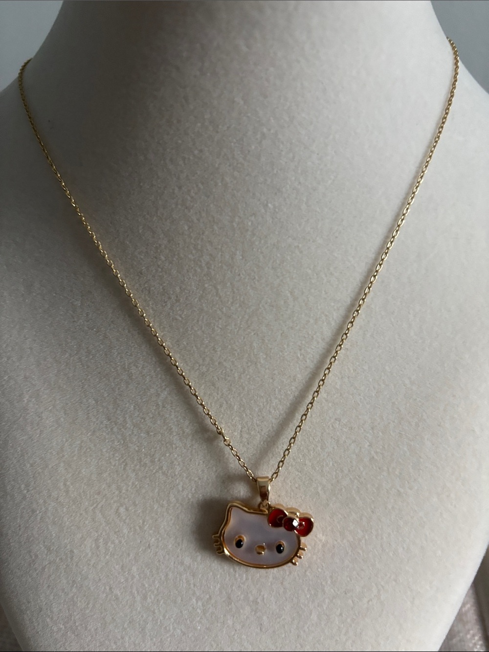 Hello Kitty Gold Tone Necklace with White Face and Red Bow